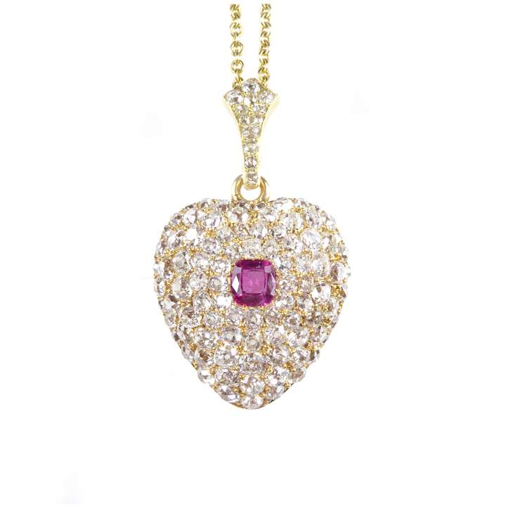 Ruby and diamond heart pendant, on a later gold chain necklace,